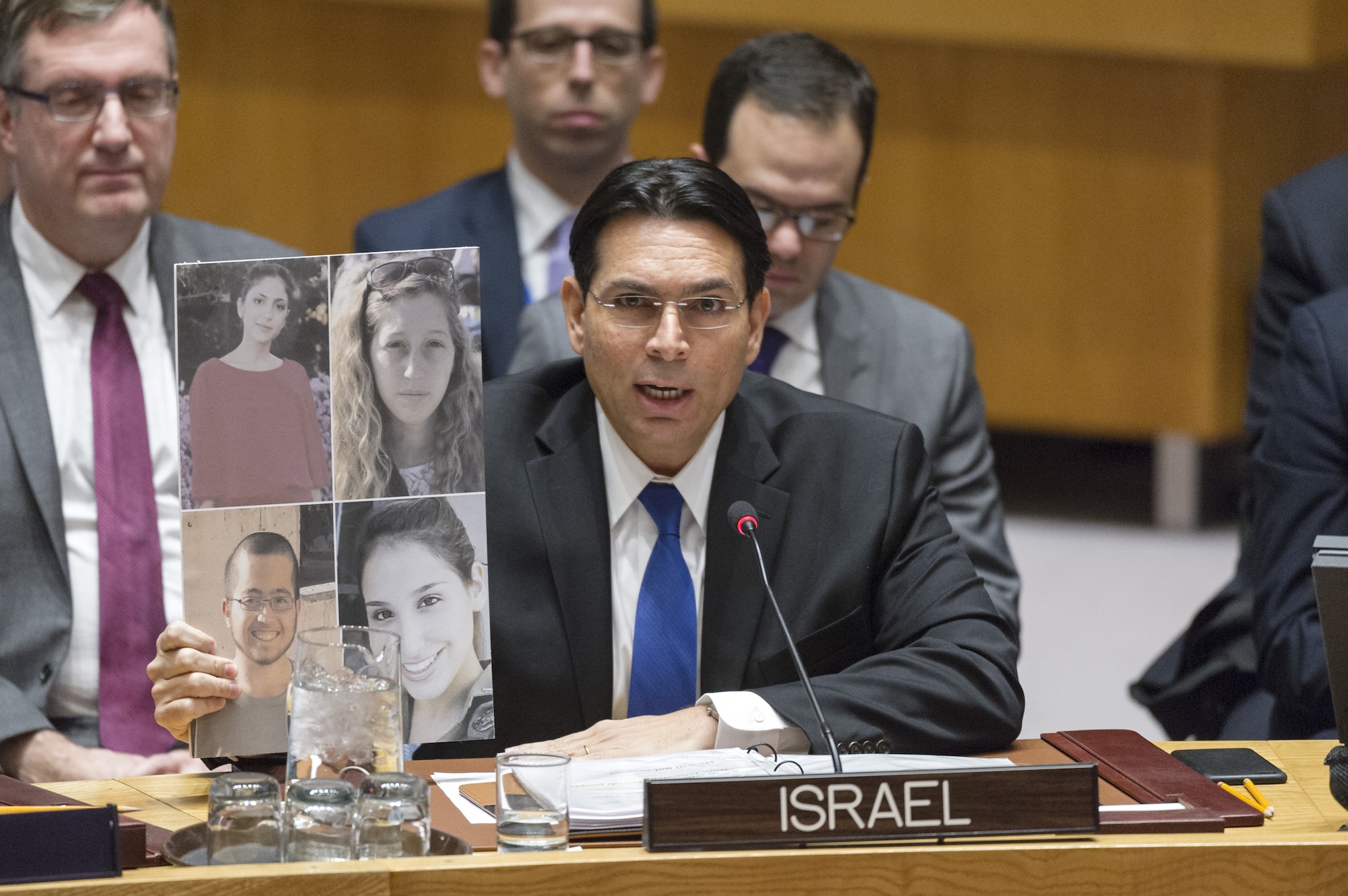 Israel's Ambassador Danny Danon addresses the Security Council Open showing the pictures of the last Israeli victims of terrorism (UN Photo/Rick Bajornas)