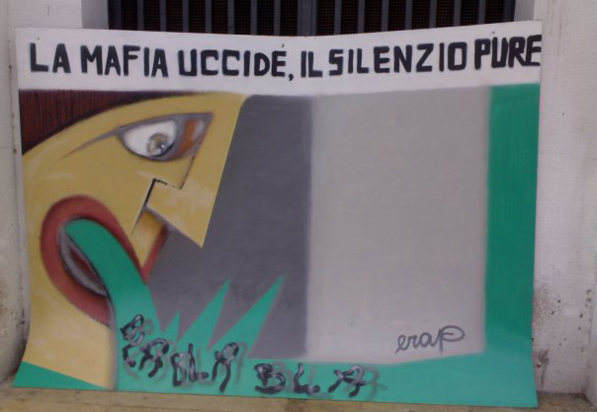 L'antimafia per moda o per obbligo Un poster di una manifestazione antimafia