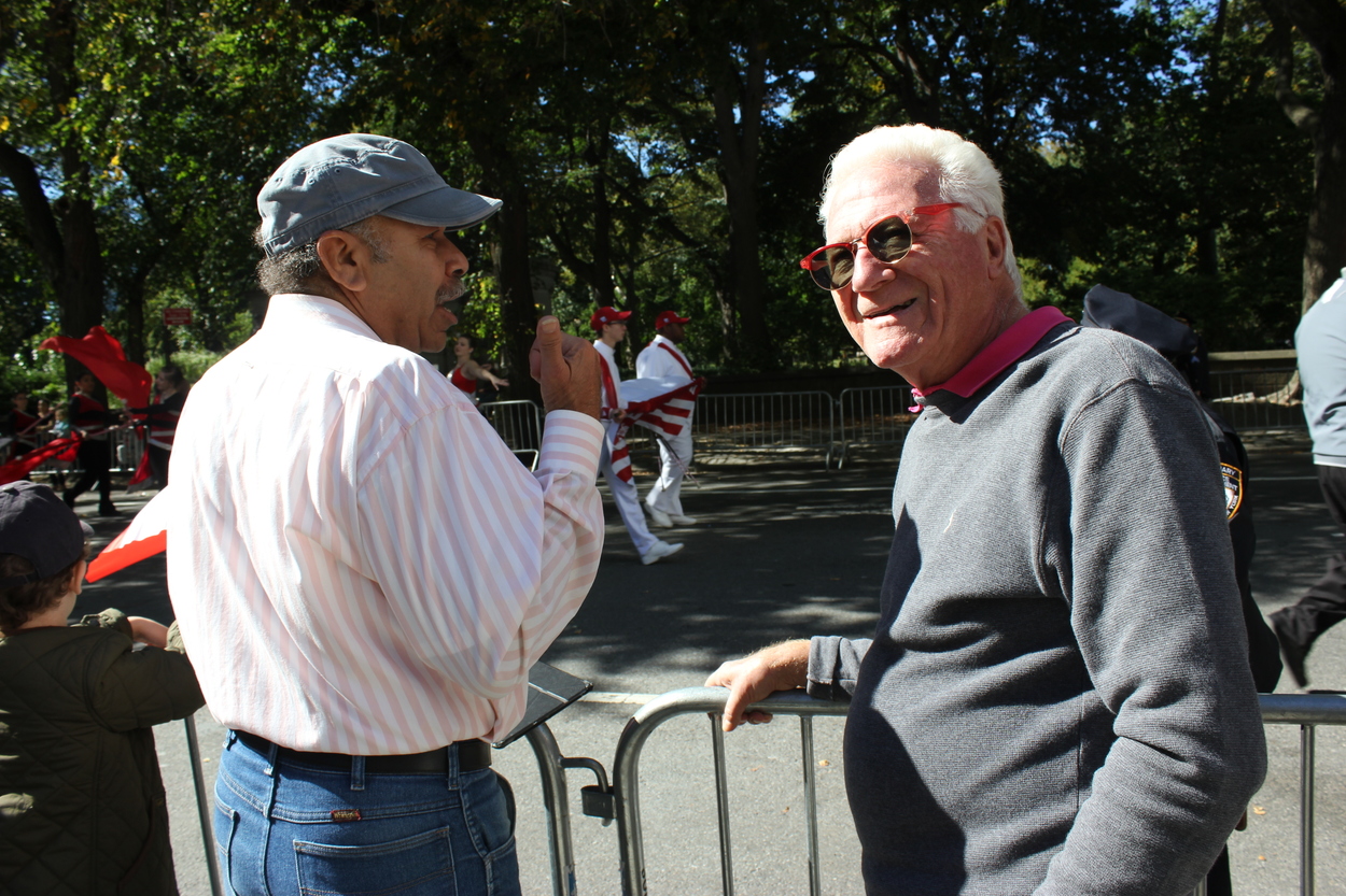 Phil (left) and Bob (right): “We like the parade and we live two blocks away. We just love being here in the sunshine.”